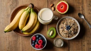 Healthy breakfast ingredients including fresh fruits, oats, and seeds