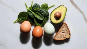 Ingredients for scrambled eggs with spinach and avocado